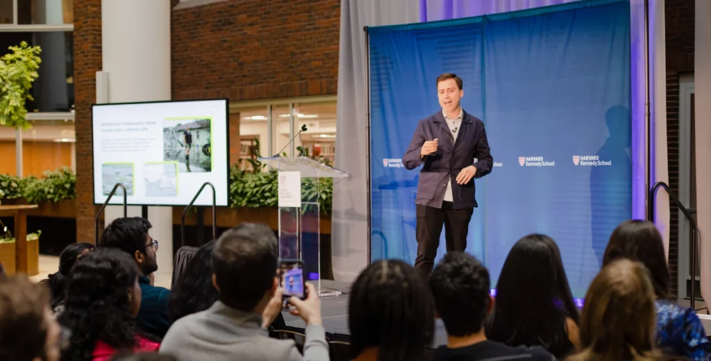 Corporate speaker presenting to audience during business conference or seminar