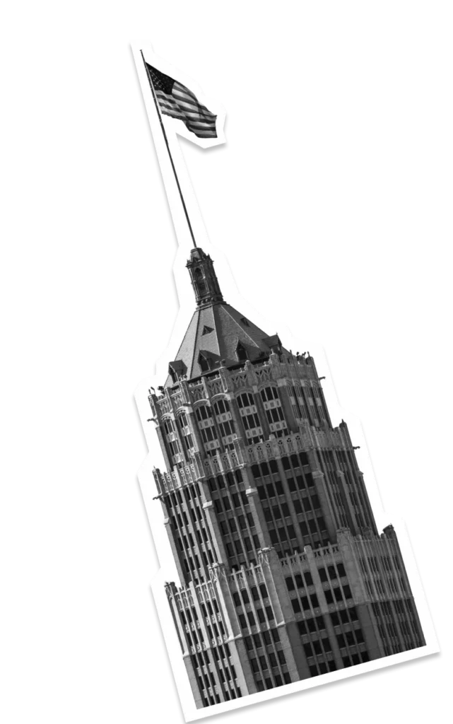 Historic downtown skyscraper with American flag and detailed architectural design